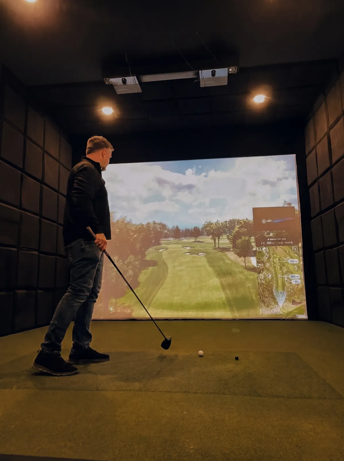 A member at address in one of the four TrackMan bays